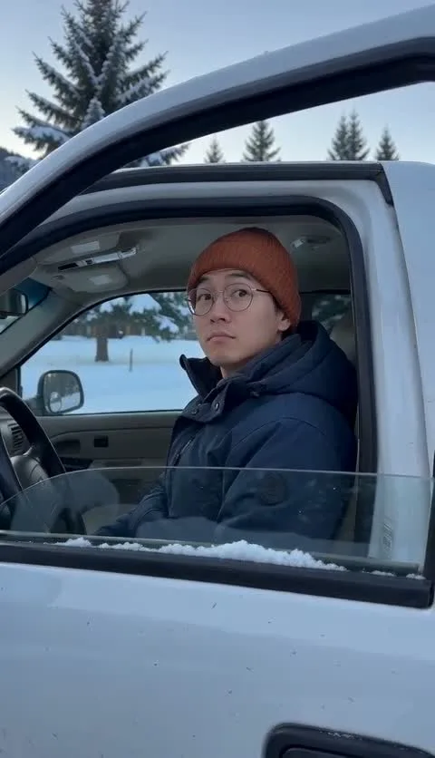 Cold weather. Colder stare. — fictional adult driver in snow cabin